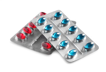 Blisters with different pills on white background