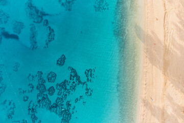 Aerial view of the paradisiacal idyllic coast with a sandy beach
