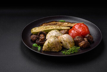 Delicious juicy grilled chicken with salt, spices and herbs with vegetables