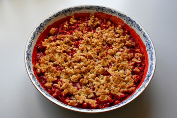 Strawberry pie with oats on gray table