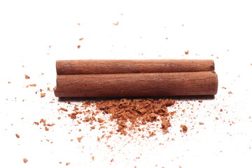 Cinnamon sticks, pieces with shavings isolated on white 