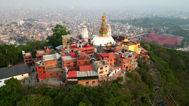 Beautiful drone shot Buddhist temple in Asia with city in background