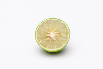 fresh lemons on plate on a white background