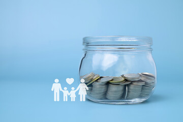 Family with coins money saving in glass jar, Financial investment, Growing money, Family saving money together for future, Money saving concept