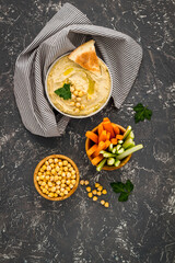 Chickpea hummus with vegetables sticks and pita croutons