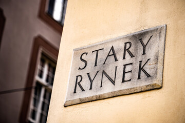 Stary rynek street sign on ancient building in Poznan on a old market square district, Poland.