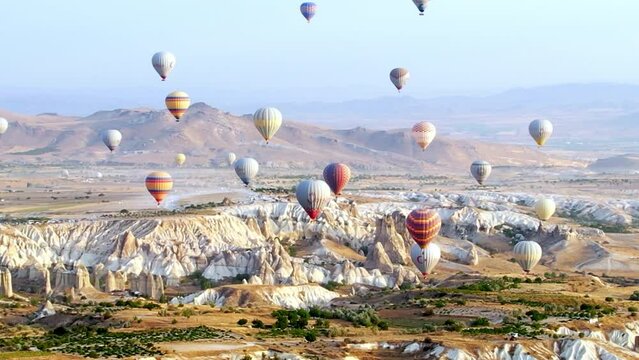 Balloons fly in Cappadocia, Turkey. Balloon in the sky aerial shot. Hot air balloon flight. Drone view
