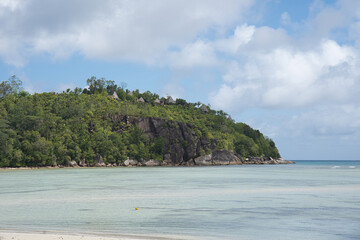 Calm sea, green lush forest and luxurious hotel between the nature, Mahe Seychelles