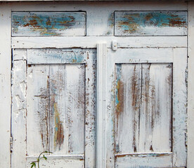texture of the old cabinet, with doors and latch, white with blue and gray, vintage shabby   