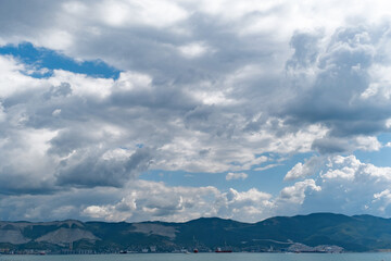 Panorama of Novorossiysk commercial sea port on the background of sky and mountains