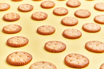  Delicious group of salty biscuits over isolated yellow background