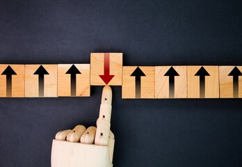 wooden squares with red arrow icons in different directions. different concepts of thought or...