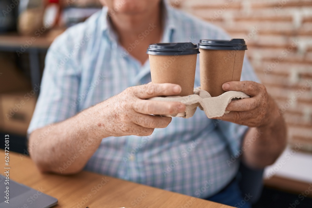 Sticker Middle age grey-haired man business worker holding take away coffee at office