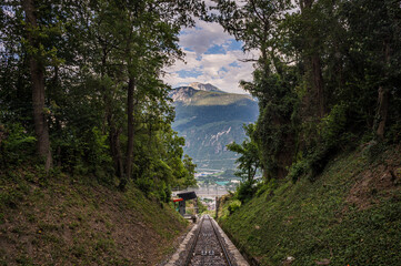 High angle view over mountain, Sierre city and funicular trail. Crans Montana, Valais Canton,...