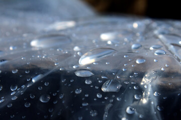some rain drops laying on plastic foils