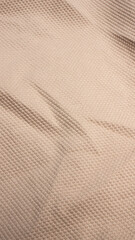 Detalle de tejido de polo beige