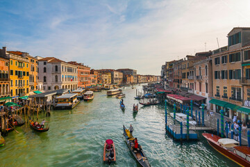 Panoramic view on famous Grand Canal among historic houses in Venice, Italy at sunny day