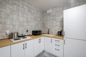 interior of modern luxure kitchen  in studio apartments with cupboard