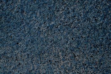 Abstract background on a cement wall.Abstract grunge background for design. Painted concrete wall with rough grainy plaster texture.