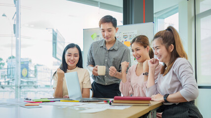 Diverse business team celebrate and collaboration and analyze financial data for long term investments