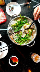 Pho boiling on the table.