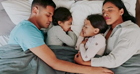 Children, sleeping and parents in bed in top view at home to relax with dreaming and care. Family, rest and kids together in bedroom or morning with comfort, love or nap for quality time in house.