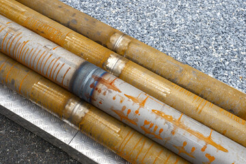 Rusty pipes. Pipeline with traces soldering. Old pipes with seam from welding machine. Rusty pipes...