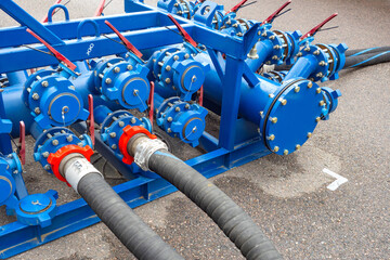 Fuel equipment. Hoses are connected to gasoline distribution system. Process of pumping fuel....