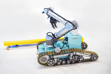 Mobile robotic complex. Robot with manipulator. Tracked radio-controlled machine. Robotics...