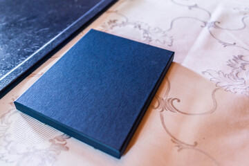 front view of blank book on white background. The book is blue used for wedding Place for text