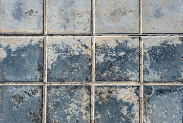 Close-up rough black dirty pavement squares texture