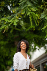 happy young african american woman smiling outdoor