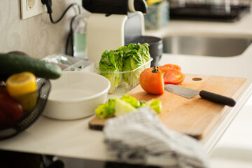 cutting board with vegetables on counter