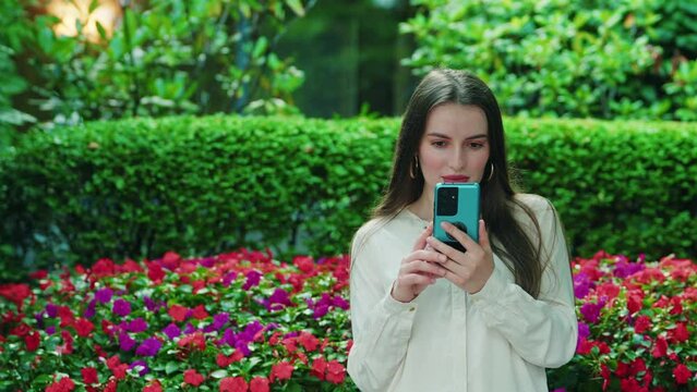 extraordinary beautiful woman looking in the phone and gets surprised while reciveing a message with possible nudity content from male person and having a "so small" reaction. Size Matter Moment