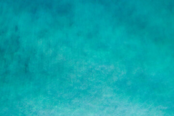 Aerial view of a clear sea water texture. View from above Natural turquoise background, green water reflection.