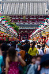 Crowds of people in Nakamise Dori Street leading towards the Senso-ji temple in Tokyo, Japan