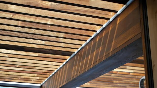 stylish thatched roof of a house made of natural materials
glass and wood are the main design materials
beautiful atmospheric streaks from the sun