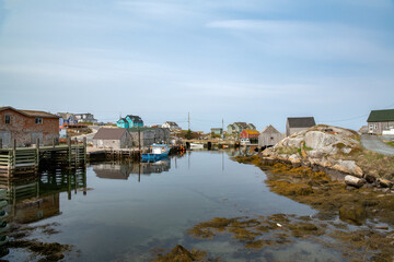 Fototapeta na wymiar Fishing village in a cove at low tide on the coast of the Atlantic Ocean.