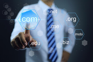 Businessman hand specified to touch and choosen sub domain name to dot com or .com to registeration the commercial website. Domain selection concept. - obrazy, fototapety, plakaty