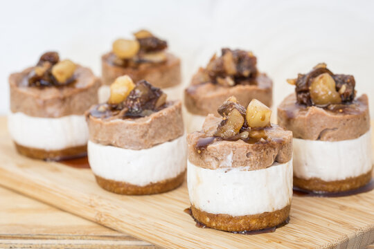 Mini raw Macadamia, choc cheesecakes served on a board