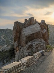 rocks and sky with greenry