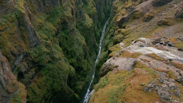 Iceland aerial view to the mountains river flows through the valley.  Glymur Waterfall in Iceland, drone 4K video. Famous tourist attractions and landmarks destinations