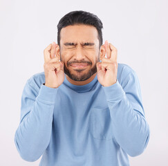 Hope, fingers crossed and asian man in studio with good luck sign for bonus, prize or giveaway on...