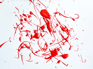 red paint on a white background