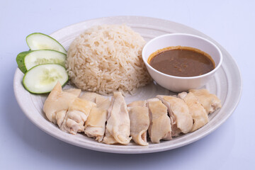 Hainanese chicken rice with soup .steamed chicken rice - Asian food style on white background