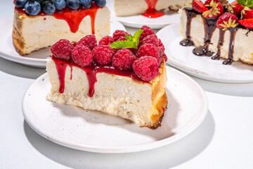 

Summer cafe baking menu background, sweet cheesecake portion slices with various toppings, jam and berry fruits - strawberry, blueberry, raspberry, cherry 