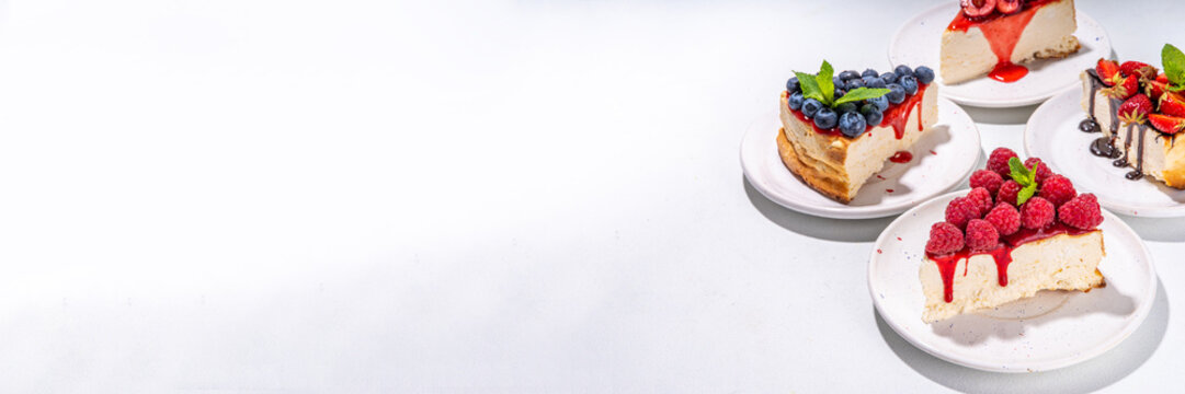 

Summer cafe baking menu background, sweet cheesecake portion slices with various toppings, jam and berry fruits - strawberry, blueberry, raspberry, cherry 