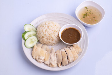Hainanese chicken rice with soup .steamed chicken rice - Asian food style on white background