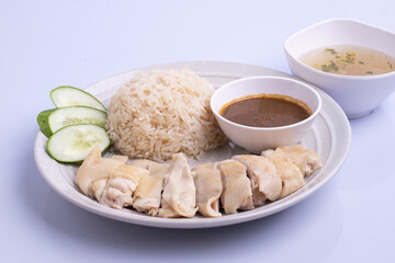 Hainanese chicken rice with soup .steamed chicken rice - Asian food style on white background