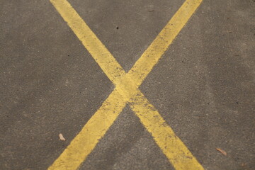 Fototapeta premium yellow lines on asphalt